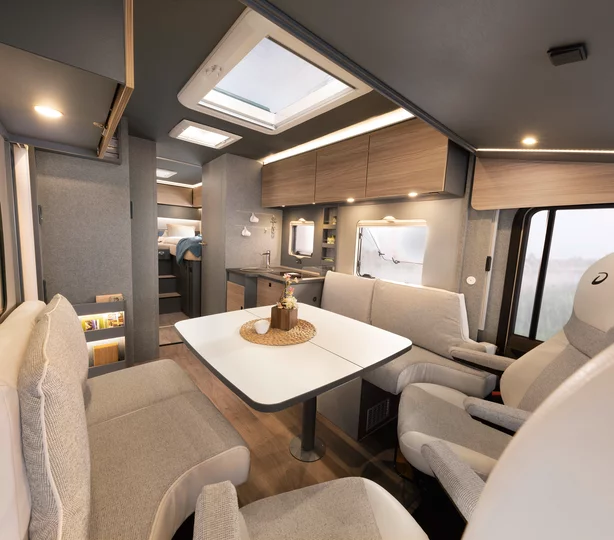 Grand Tourer lounge and dining area with skylight and panoramic windows